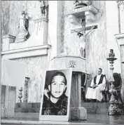  ?? Valeria Fernandez
Associated Press ?? AT A CHURCH in Nogales, Mexico, a poster of Jose Antonio Elena Rodriguez, who was shot through a border fence and killed by a Border Patrol agent.