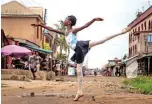  ??  ?? A student of the Leap of Dance Academy, Precious Duru, performs a dance routine in Okelola street in Ajangbadi.