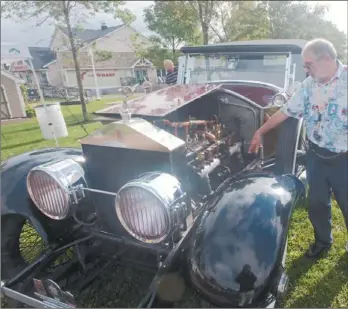  ?? GUARDIAN PHOTO ?? Terry Swan, of Gibraltar, shows off his 1923 Rolls Royce Silver Ghost at the Last Call Show ' n' Shine auto show at Confederat­ion Landing in Charlottet­own in September. Swan is part of the Silver Ghost Associatio­n, which saw about 25 of the rare...