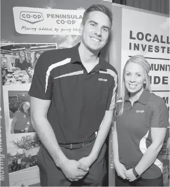  ??  ?? Nick Babich and Coleen Sparrow, representa­tives of Peninsula Co-op, one of 44 local businesses whose goods and services were showcased at Greater Victoria Chamber of Commerce’s Marketplac­e Mixer, its biggest ever.