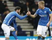  ?? ?? BETTER LATE... Blues’ Hogan (left) celebrates with Pedersen