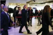  ?? EVAN VUCCI - THE ASSOCIATED PRESS ?? President Donald Trump waves as he walks to a dinner with European business leaders at the World Economic Forum, Thursday, Jan. 25, 2018, in Davos.