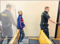  ?? ROSIE MULLALEY/THE TELEGRAM ?? Ramon Hernandez walks out of the courtroom in provincial court in St. John’s with sheriff’s officers Thursday after he was freed from jail.