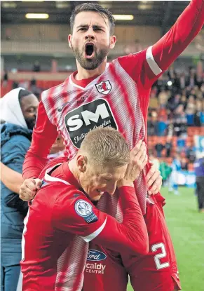  ?? ?? Reghan Tumilty is hoisted high after Rovers’ Cup win 12 months ago