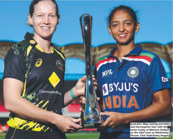 ?? ?? Australia’s Meg Lanning and India’s and Harmanpree­t Kaur with the series trophy at Metricon Stadium on the Gold Coast on Wednesday. Picture: Chris Hyde/getty Images