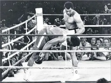  ?? Associated Press ?? A LIGHTNING-FAST right by Muhammad Ali stopped George Foreman in the eighth round of the 1974 fight in Zaire billed as the “Rumble in the Jungle.” Earlier, Ali had tired out Foreman with his “rope-a-dope” tactic.