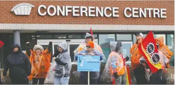  ?? TONY CALDWELL ?? Civilian military workers on the picket line in Ottawa in late February. Workers at bases in Ottawa, Kingston and Petawawa voted to ratify a contract that includes a pledge to work toward a national wage grid.