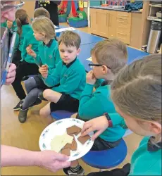  ??  ?? Corrie Primary pupils were more than happy to taste test Fairtrade chocolate.