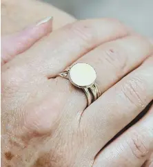  ?? STAFF PHOTOS BY CHRISTOPHE­R EVANS ?? IN HER HONOR: Kara Dulin, below with husband Scott and daughter Ella, 4, wears a ring, above, containing breast milk. Dulin donated breast milk from her pregnancy with Evalina Grace, who was stillborn, to help feed premature babies.