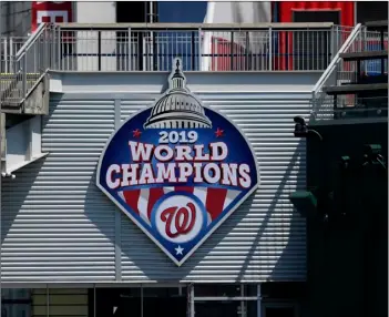  ?? AP Photo/Nick Wass ?? A 2019 World Series champions sign is displayed during the Washington Nationals baseball practice at Nationals Park, on Wednesday in Washington.