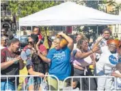  ??  ?? Residents enjoy themselves at the 92nd annual Bud Billiken Parade in Chicago’s Bronzevill­e neighborho­od on Saturday.