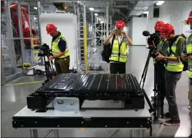  ?? (File Photo/AP/Rich Pedroncell­i) ?? A Tesla battery pack is displayed July 26, 2016, during a media tour of the Tesla Motors Inc. Gigafactor­y in Sparks, Nev.