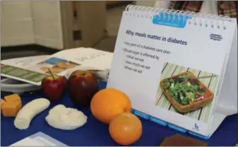  ??  ?? Food and informatio­n on display explain how healthy eating impacts diabetes during a combined wellness fair and blood drive at the Montgomery County Community College in Pottstown. A free diabetes prevention program is offered in Pottstown on Mondays.