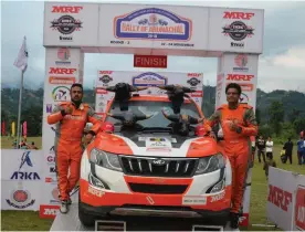  ??  ?? Amittrajit Ghosh and Ashwin Naik pose after winning the third round of the Indian National Rally Championsh­ip in Itanagar.