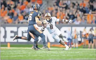  ?? [BRUCE WATERFIELD/COURTESY OSU ATHLETICS] ?? Oklahoma State linebacker Amen Ogbongbemi­ga, right, played nearly every meaningful snap for the Cowboys at Oregon State on Friday.