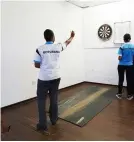  ?? ?? GAME FOR ALL.... Darts game caters for people living with disabiliti­es