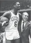  ??  ?? Legendary Boston Celtics coach Red Auerbach, seen here celebratin­g with Bill Russell, who won nine NBA championsh­ips in 10 years, won his 1,000the game with the Celtics, 52 years ago today.