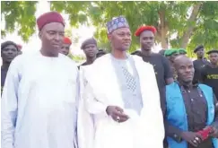  ??  ?? Borno State Commission­er for Local Government­s and Emirate Affairs, Sugun Mai Mele (standing right) with a community leader at Damasak town