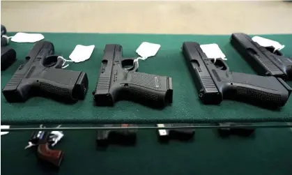  ?? ?? A selection of Glock pistols are seen for sale. Gun deaths have risen steadily since 2005 then jumped 20% from 2019 to 2021. Photograph: Rick Wilking /Reuters