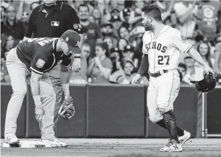  ?? Karen Warren / Houston Chronicle ?? Jose Altuve, right, pays for a baserunnin­g miscue in the fourth inning Monday night, getting tagged out by the A’s Matt Chapman after trying to take two bases on a wild pitch.