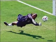  ?? Eric Risberg / Associated Press ?? United States goalkeeper Briana Scurry blocks a penalty shootout kick by China’s Ying Liu during overtime of the Women’s World Cup final in 1999.