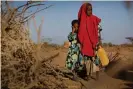  ??  ?? Tirig and her sister Saua in Somalia. Their family was forced to leave their home in search of water and food. Photograph: Kate Holt/Unicef