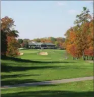  ??  ?? The 18th fairway of Hershey’s Mill’s championsh­ip course leads up to the community’s club house.