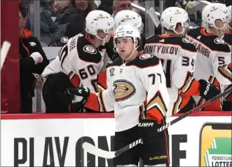  ?? GENE J. PUSKAR — THE ASSOCIATED­E PRESS ?? The Ducks' Frank Vatrano celebrates with the bench after scoring a goal against the Penguins during Monday's game at Pittsburgh. Vatrano is tied for the NHL lead with nine goals in nine games this season.