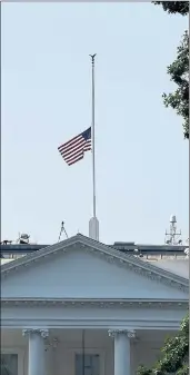  ?? SUSAN WALSH — THE ASSOCIATED PRESS ?? The United States flag flies at half-staff over the White House to honor the five people killed in the Annapolis, Md., shooting at the Capital Gazette newspaper.