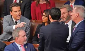  ?? AP PHOTO/ALEX BRANDON ?? Above: Rep. Matt Gaetz, R-Fla., left, talks to Rep. Kevin McCarthy, R-Calif., right, Jan. 6 in the House chamber as the House met for the fourth day to elect a speaker and convene the 118th Congress in Washington. Below: That same day, Richard Hudson, R-N.C., left, pulls back Rep. Mike Rogers, R-Ala., as they talk with Gaetz.