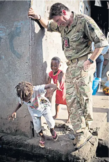  ?? ?? Maj Gen Herbert during a 2015 tour of Sierra Leone, when he was part of an Army-led project to support survivors of Ebola