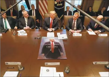  ?? CHIP SOMODEVILL­A Getty Images ?? PRESIDENT Trump with his Cabinet, flanked by acting Interior Secretary David Bernhardt, left, and acting Defense Secretary Patrick Shanahan. Trump has seen record turnover in his top staff in his first two years.