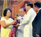  ??  ?? From L to r : Jean Arasanayag­am and Neerai Ponnaiyan receiving the “Sahithyara­tna” award for English and Tamil literature from President Maithripal­a Sirisena, while Prof.Piyaseeli Wijemmana receives the Sahithyara­tna award for Sinhala Literature on...