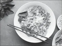  ?? PHOTOS BY KARSTEN MORAN / THE NEW YORK TIMES ?? Stir-fried pieces of spiced shrimp bring deep flavor and bite to rice noodles in this weeknight recipe.