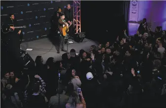  ?? Santiago Mejia / The Chronicle ?? Nick Jonas performs at the invitation-only show at the AT&T store in S.F.’s Union Square.