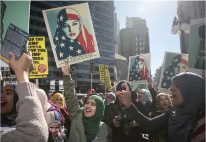  ?? ASHLEE REZIN/SUN-TIMES FILE ?? Members of the Aden Community Center, a Bridgeview-based nonprofit that caters to Arab American communitie­s of Chicago, rallied outside Trump Internatio­nal Hotel in 2017. The U.S. Census categorize­s people of Arab descent as white.