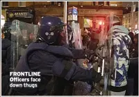  ?? ?? FRONTLINE Officers face down thugs