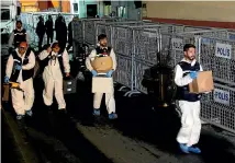  ?? AP ?? Turkish forensic officers leave the Saudi consulate in Istanbul after conducting a search over the disappeara­nce and alleged slaying of writer Jamal Khashoggi. It seems almost certain Khashoggi was murdered by the Saudi government.