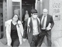  ?? BOB VAN VORIS BLOOMBERG ?? Former FTX engineerin­g chief Nishad Singh (center) departs from federal court in New York on Tuesday.