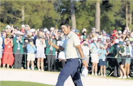  ?? CURTIS COMPTON/AJC/AP ?? Windermere resident Hideki Matsuyama reacts after winning the 2021 Masters at Augusta National Golf Club on Sunday in Augusta, Ga. While the coronaviru­s pandemic raged in 2020, golf experience­d an unanticipa­ted resurgence, with rounds up nearly 14%.