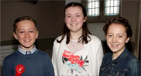  ??  ?? Cousins Conor Sidney, Ava Dillon and Muireann Hayes, pupils from Rathangan NS who made their confirmati­on in Our Lady of The Assumption and St Laurence O’Toole Church, Rathangan.