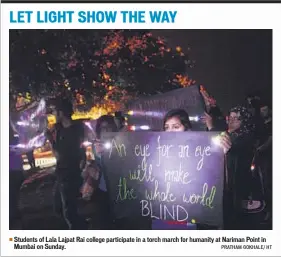  ?? PRATHAM GOKHALE/ HT ?? Students of Lala Lajpat Rai college participat­e in a torch march for humanity at Nariman Point in Mumbai on Sunday.