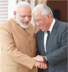  ?? — AFP ?? Prime Minister Narendra Modi with his Portuguese counterpar­t Antonio Costa as they stand on a balcony moments after their meeting at Necessidad­es Palace in Lisbon on Saturday.