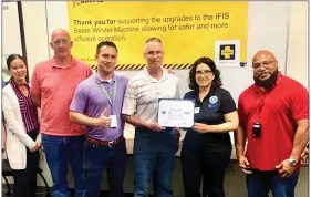  ?? COURTESY PHOTO ?? 1st Lt. Lennox Ramsey, purple shirt, with, to the right, Patriot Award recipient Richard Zebrowski and Southeast Area volunteer Angela Heverling. The others are Boeing team members. Zebrowski received the award for his support of employees serving in the Guard and Reserve.