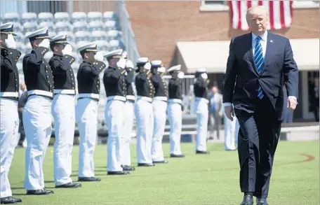 ?? Saul Loeb AFP/Getty Images ?? PRESIDENT TRUMP arrives before his commenceme­nt address Wednesday at the Coast Guard Academy in New London, Conn.