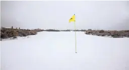  ??  ?? Snow covers a Scottsdale golf course on Thursday.