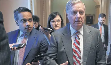  ?? AFP ?? US Senator Lindsey Graham, right, arrives at the office of Senate Majority Leader for a meeting on Thursday.