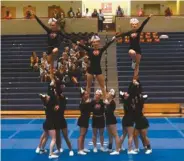  ??  ?? The Lady Bulldogs cheer squad at the Northgate Invitation­al.