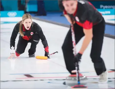  ?? The Canadian Press ?? Kaitlyn Lawes, left, reacts as teammate John Morris sweeps during mixed doubles curling action again Norway at the XXIII Olympic Winter Games in Gangneung, South Korea, on Wednesday night. Canada lost 9-6.