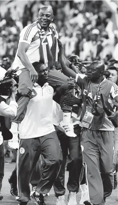  ??  ?? Super Eagles Manager, Stephen Keshi is lifted by his assistants after winning the 2013 Africa Cup of Nations trophy at FNB Stadium on February 10, 2013 in Johannesbu­rg, South Africa.